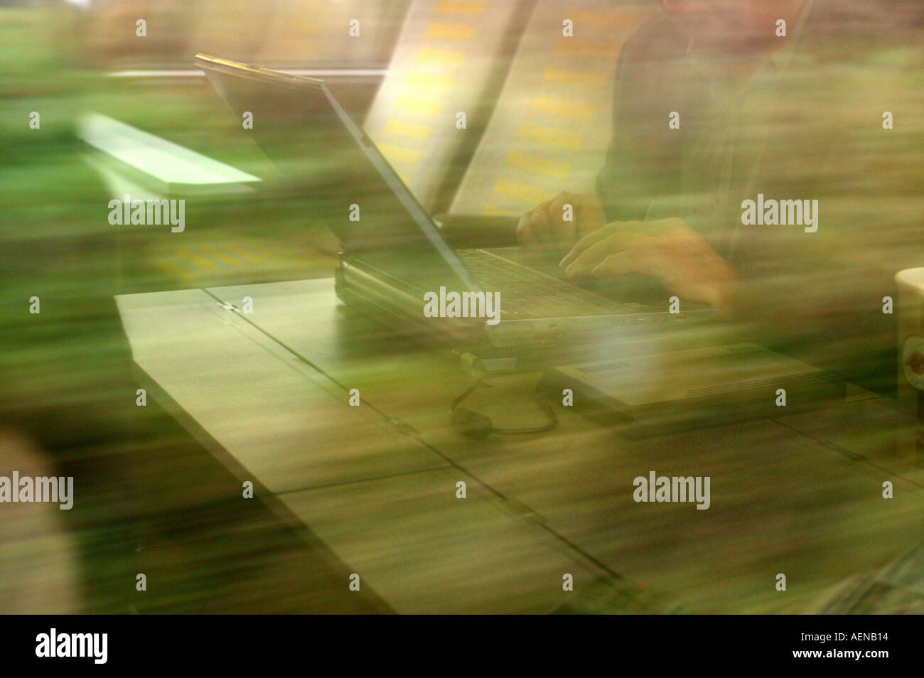 Reflection of business man using laptop on train Stock Photo