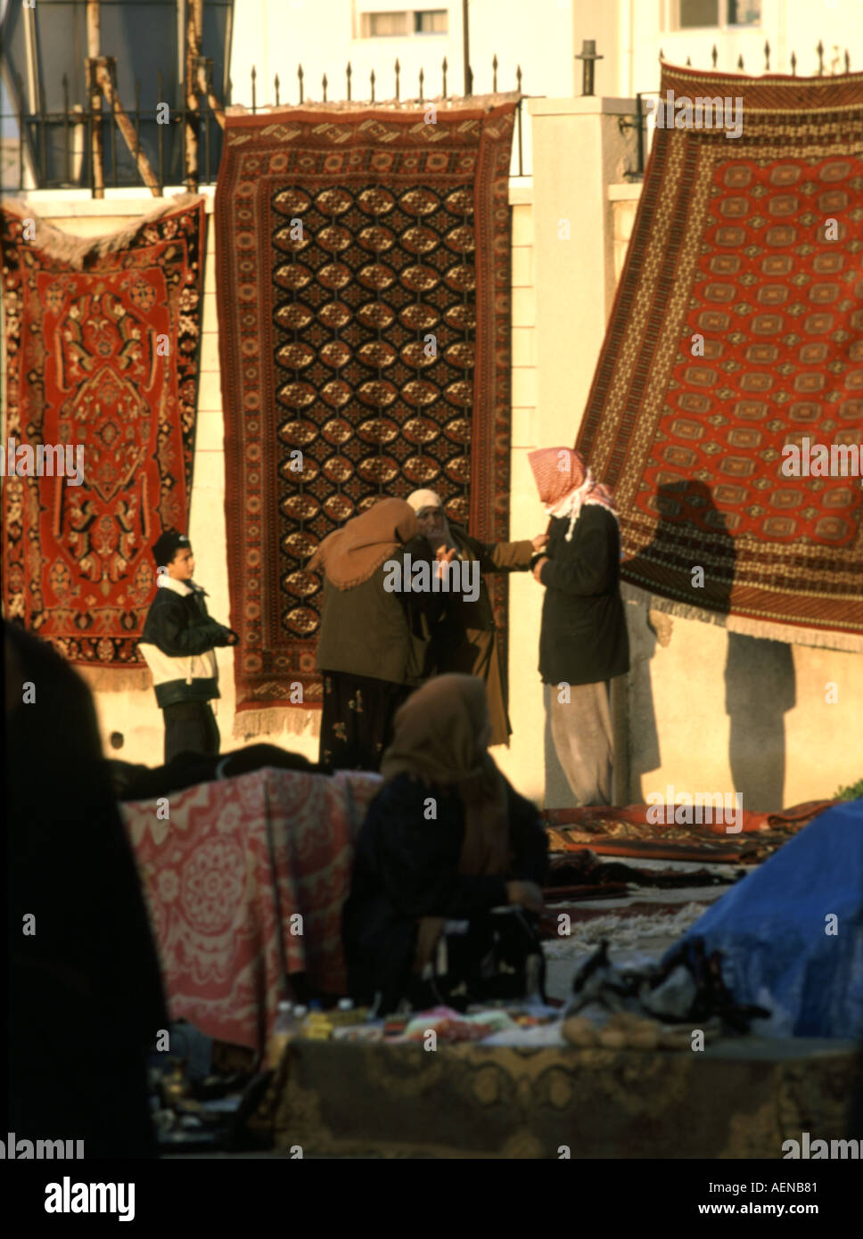 Rugs hung for sale by Muslim Haj pilgrims passing through Amman Jordan Stock Photo