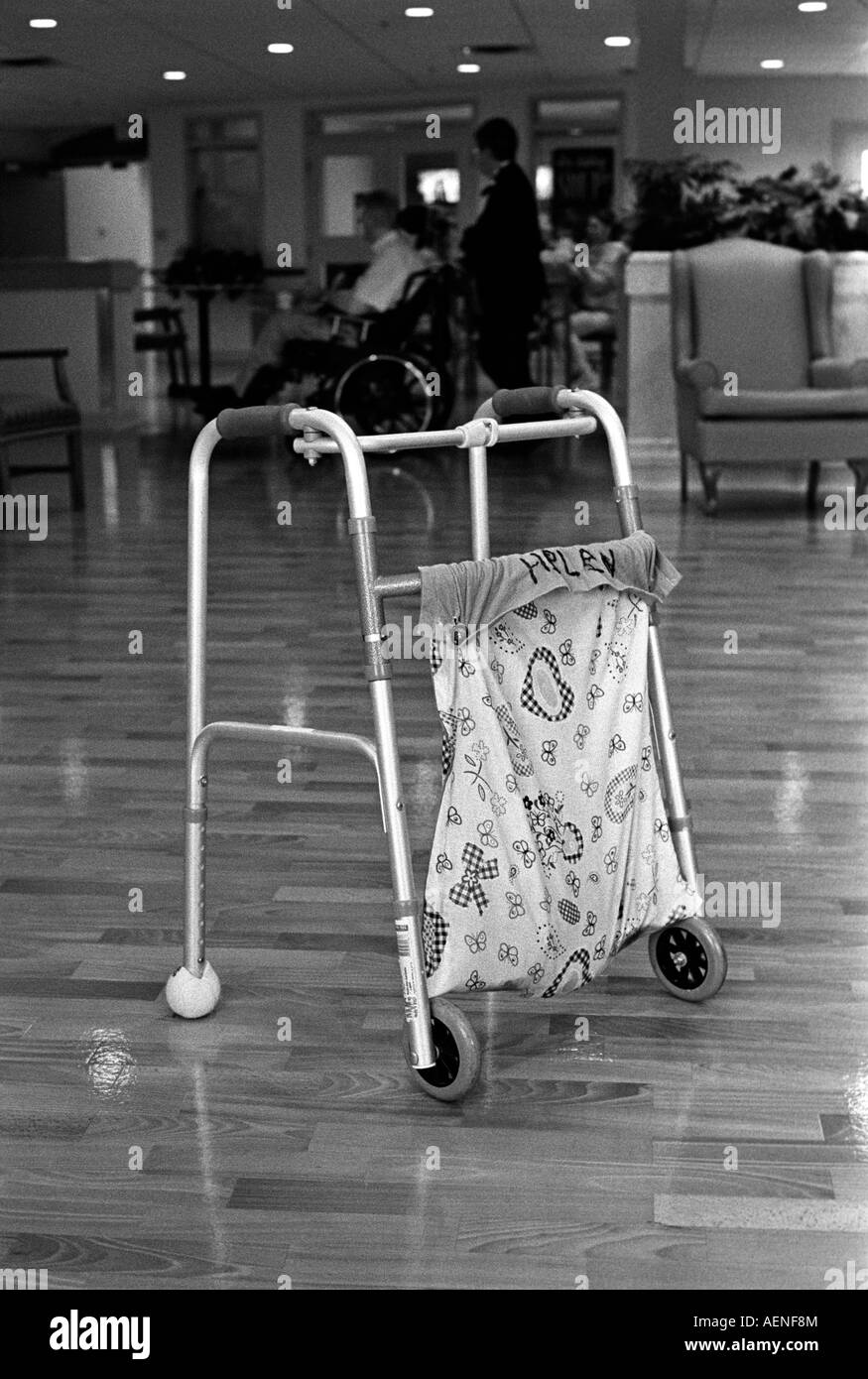 A walker sits alone in the middle of the floor Stock Photo Alamy