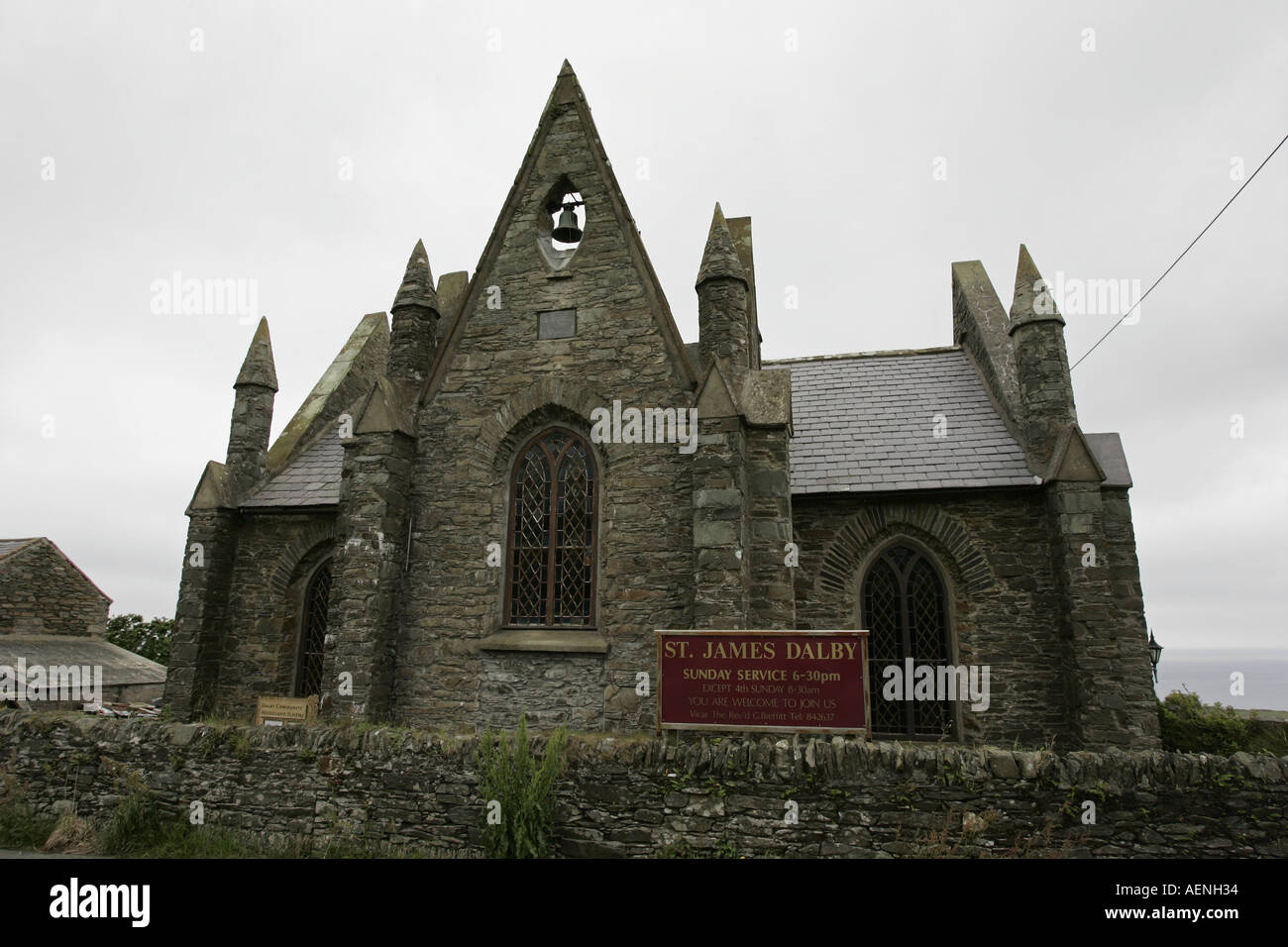 St James saint church Dalby IOM against a cloudy grey gray sky Stock