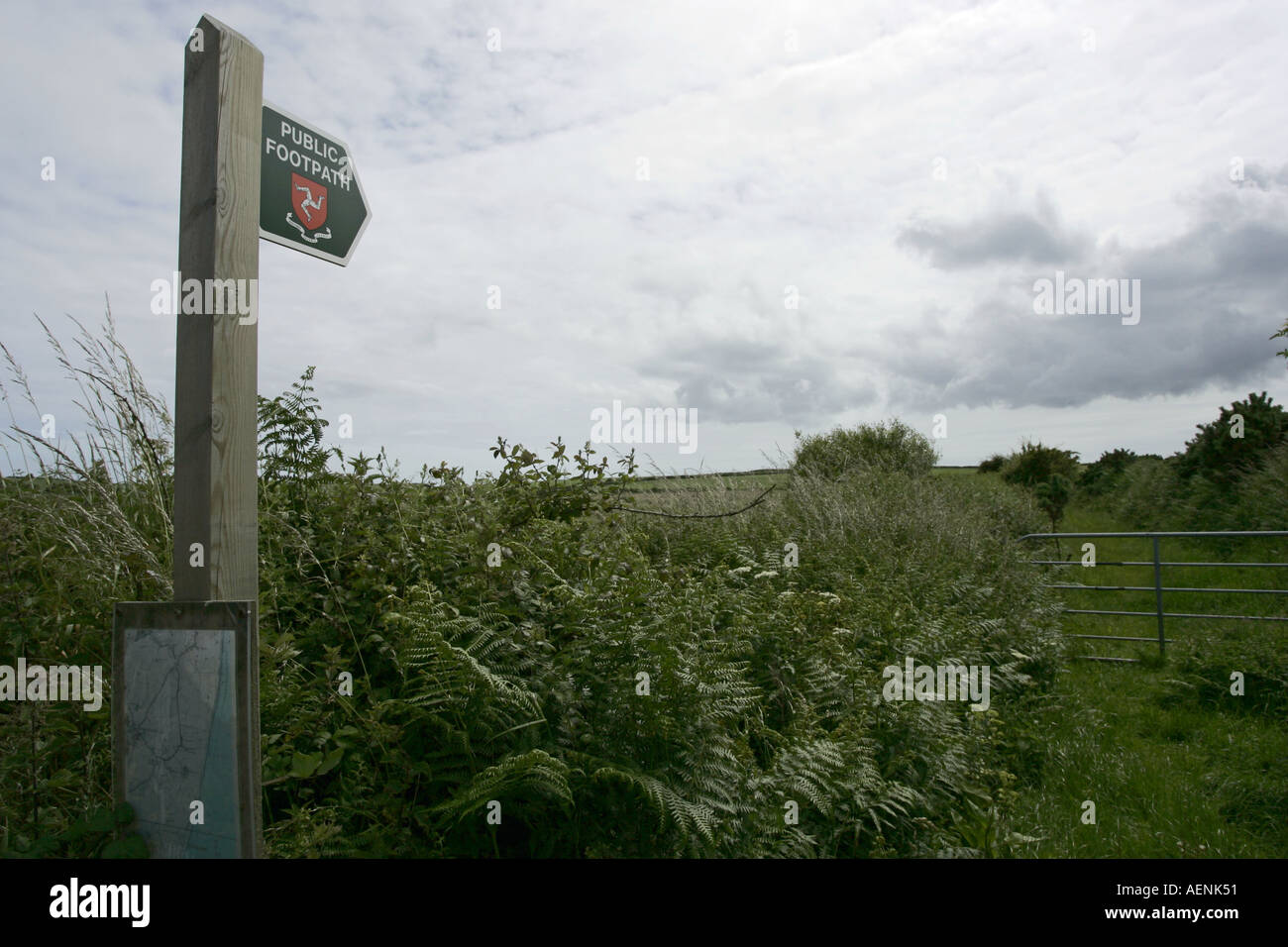 country walking signpost pointing up laneway near point of ayre isle of man manx IOM Stock Photo