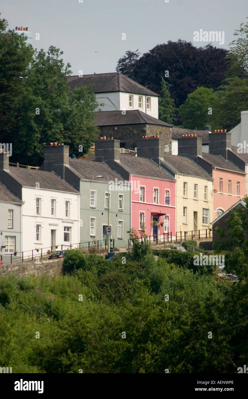 Row of pretty pastel coloured victorian terraced houses in the sunshine