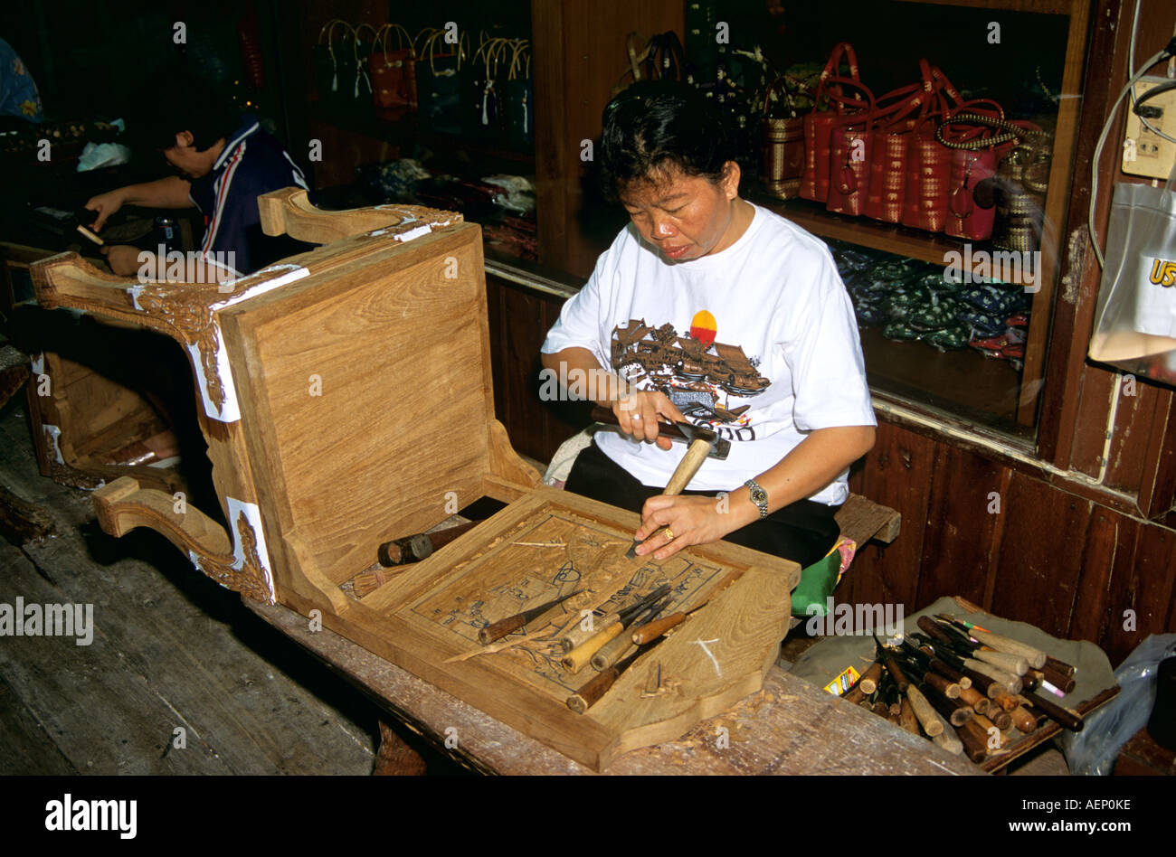 Wood carver working in furniture factory, near Bangkok, Thailand Stock