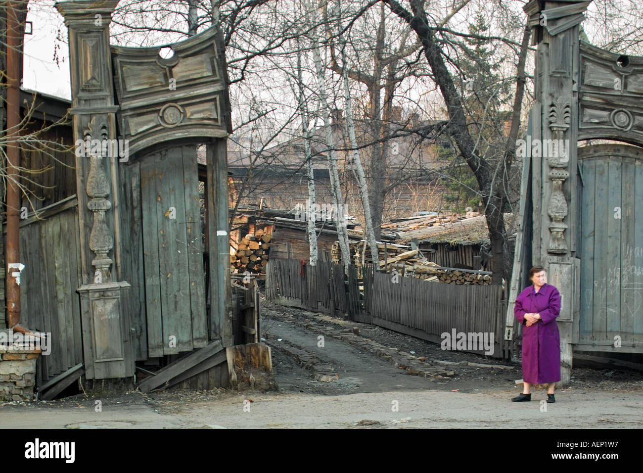 Old carved wooden gates leading to timber yard in Tomsk, Siberia. Stock Photo