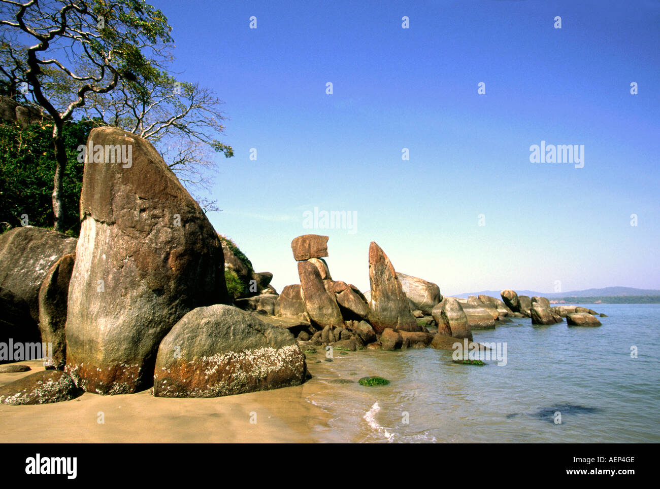 India Goa Agonda pointed rocks on beach Stock Photo