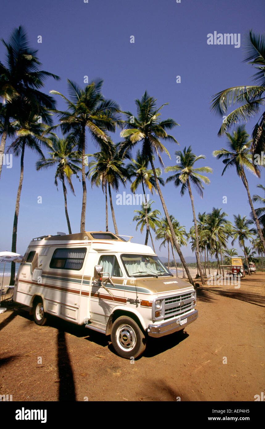 India Goa Agonda tourism overlanders camping in motorhome behind the beach Stock Photo