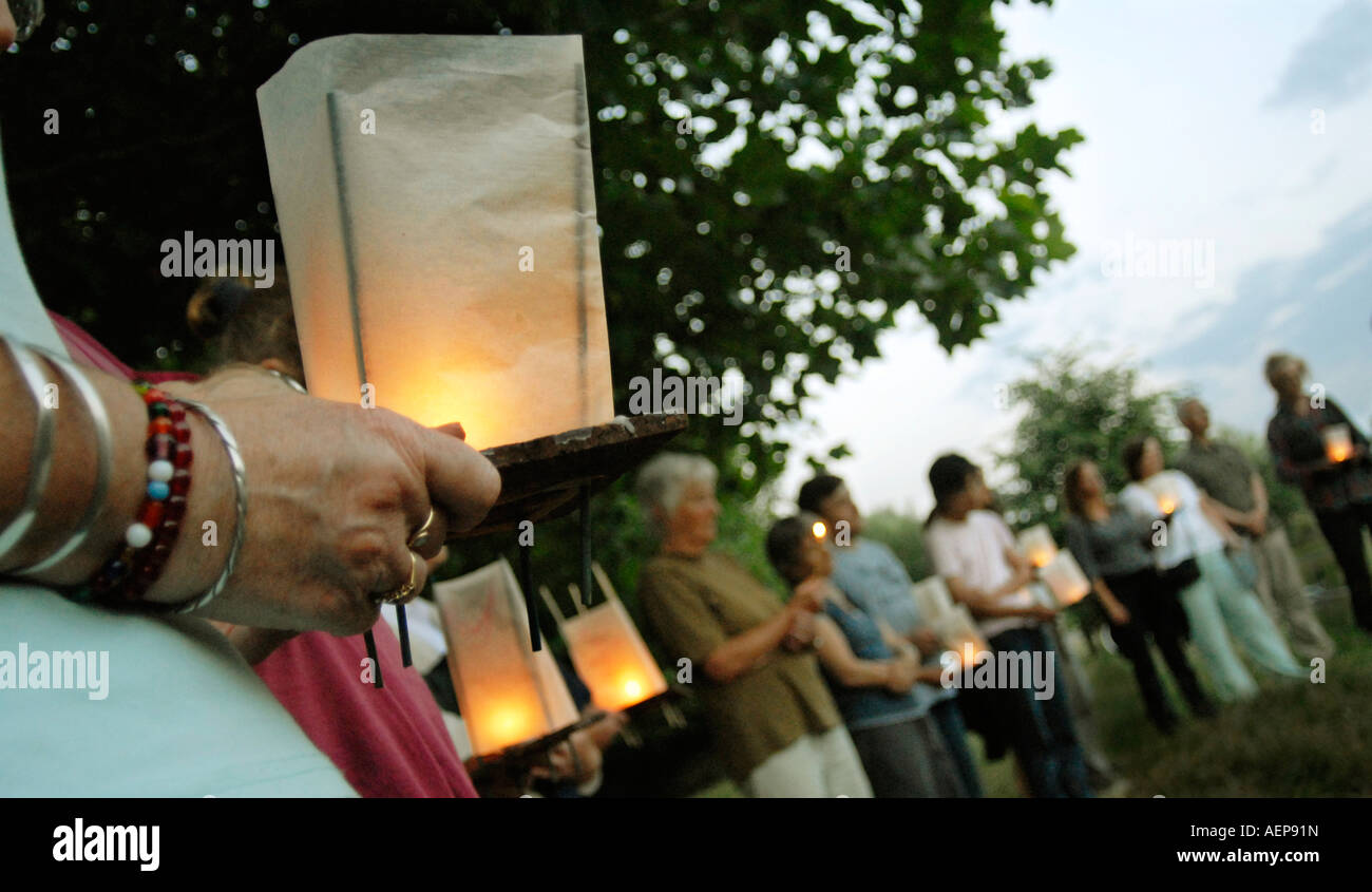 People holding lanterns at a rememberance service in Cambridge England for the victims of nuclear warfare Stock Photo