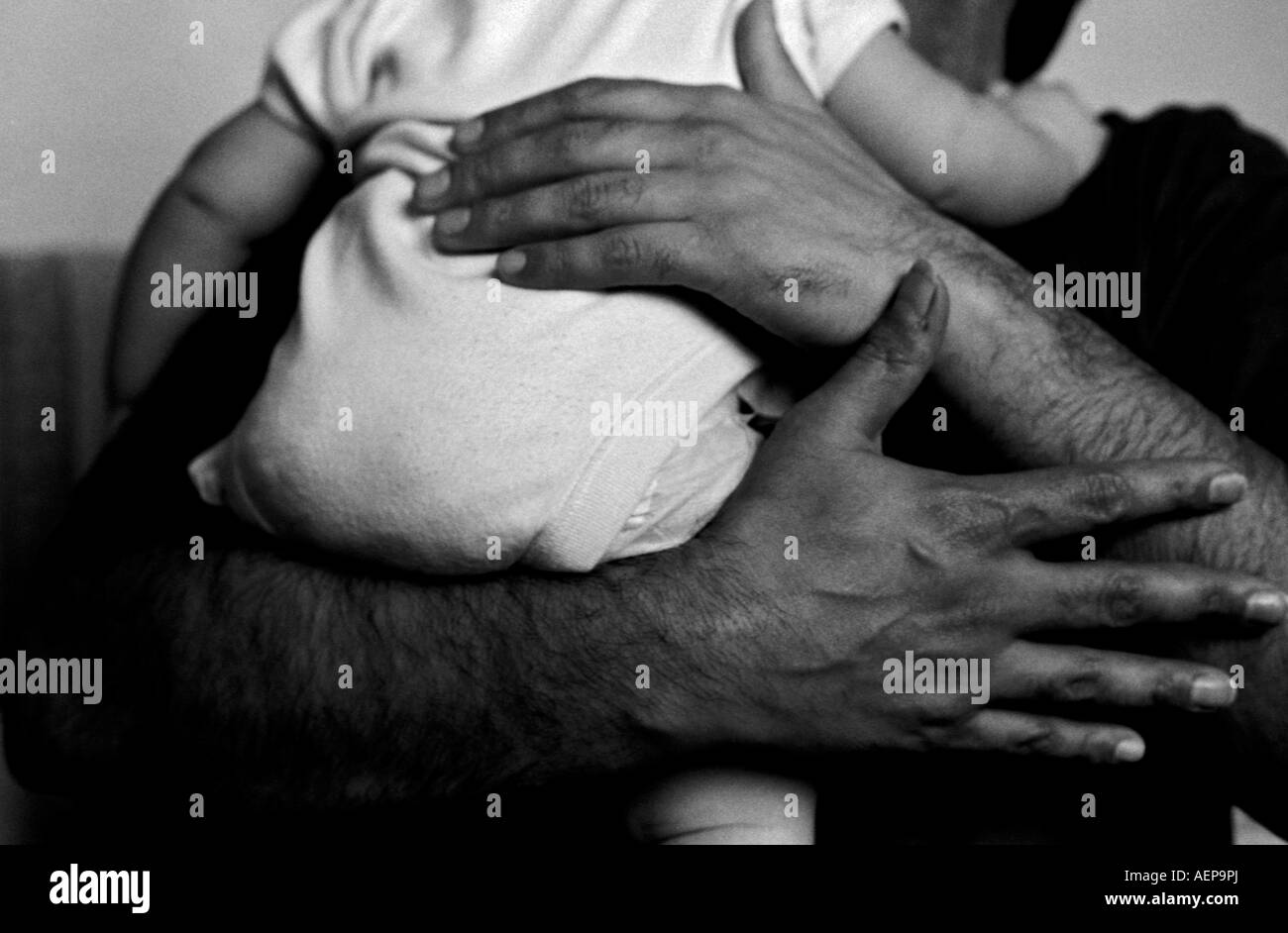 A father holds his baby son. Stock Photo