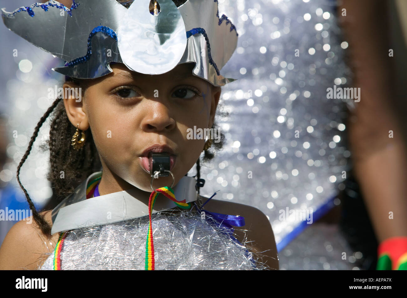 Notting Hill Carnival, little girl blowing a whistle, London, UK Stock
