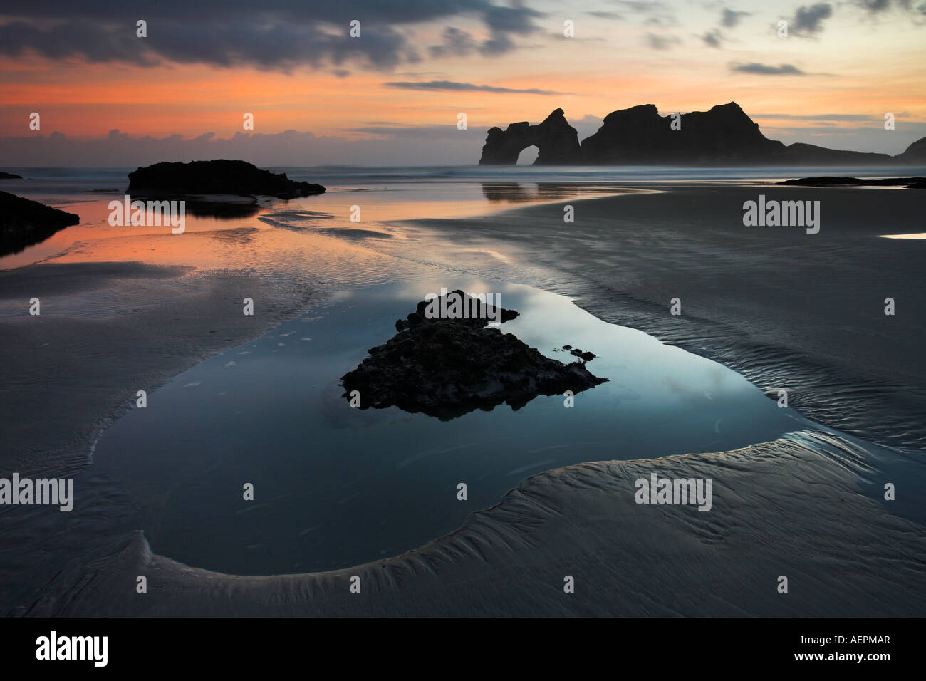 Sunrise on Wharariki Beach, South Island, New Zealand Stock Photo