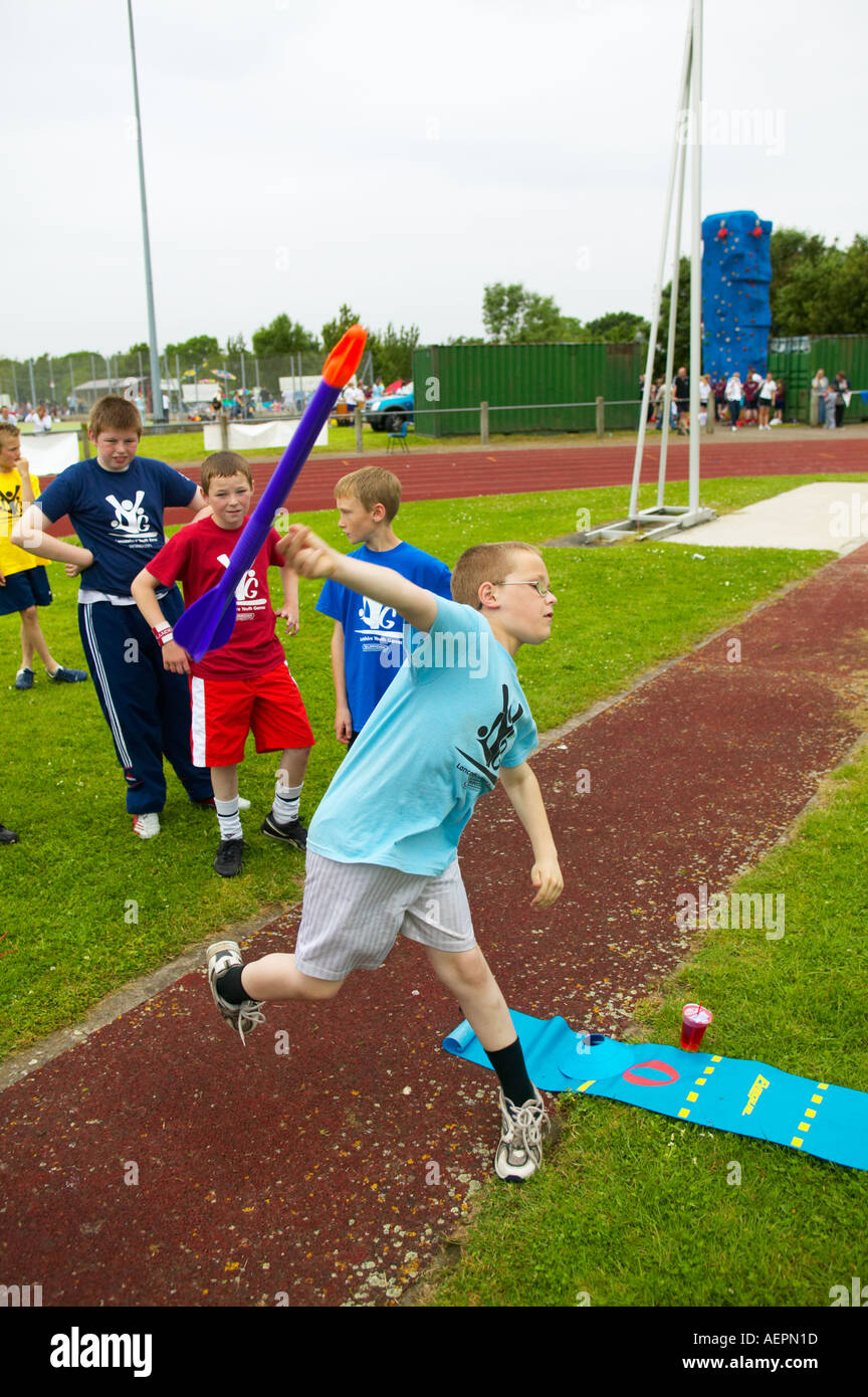 young boy throwing a plastic javelin at a sporting event Stock Photo