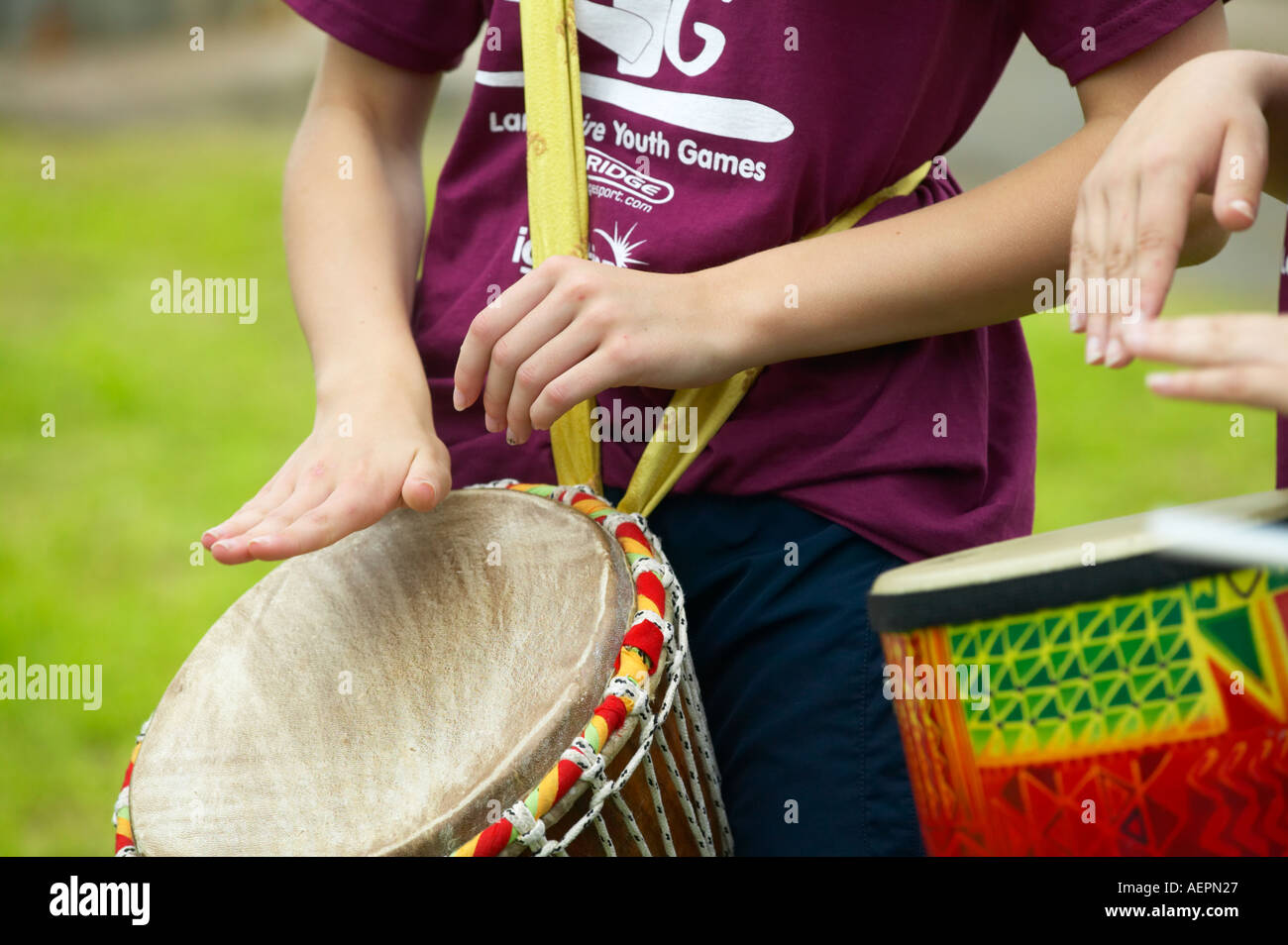 young girl playing a drum at a sporting event Stock Photo