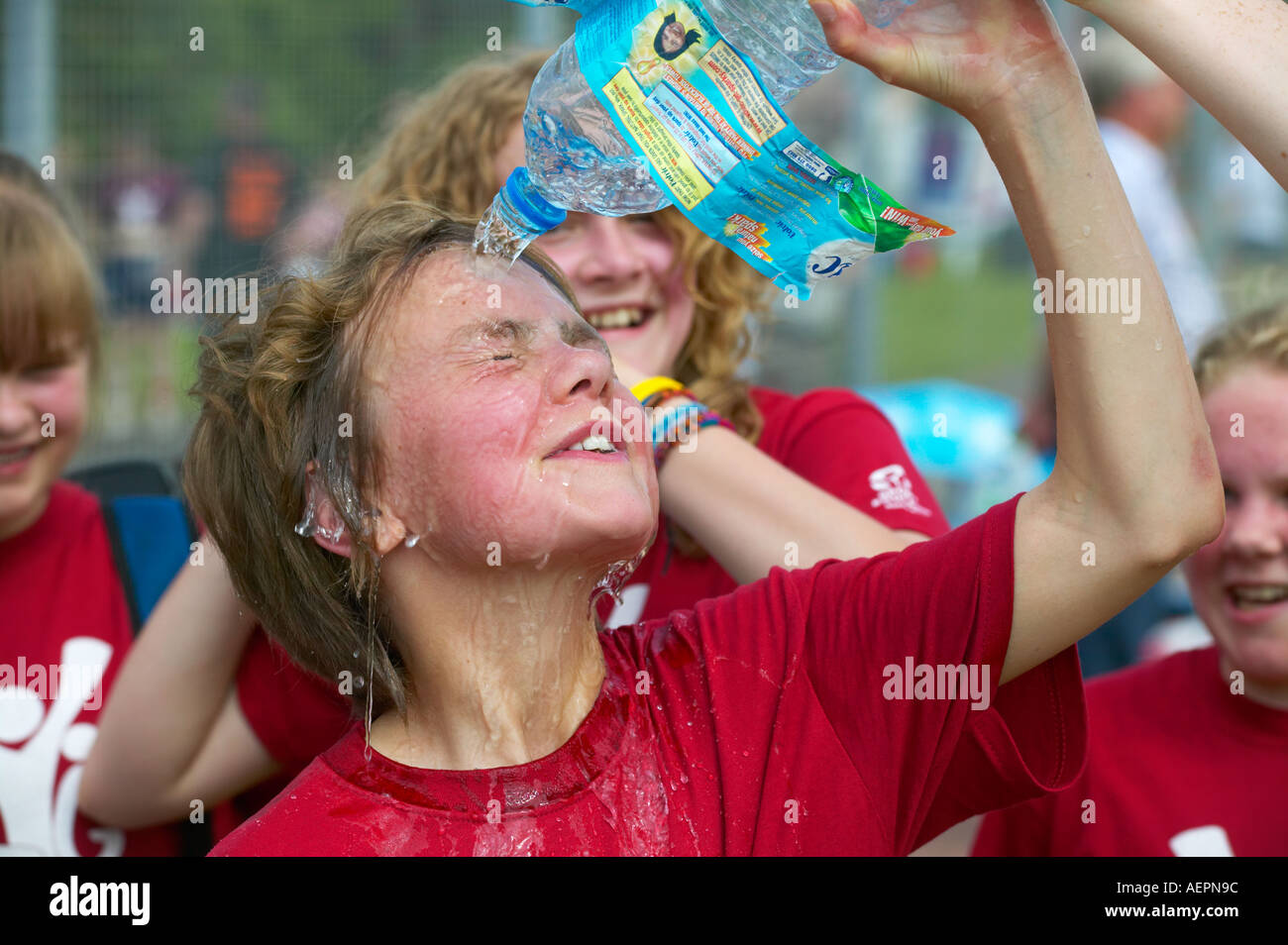 young girl cooling down after competing in a hockey match Stock Photo Alamy