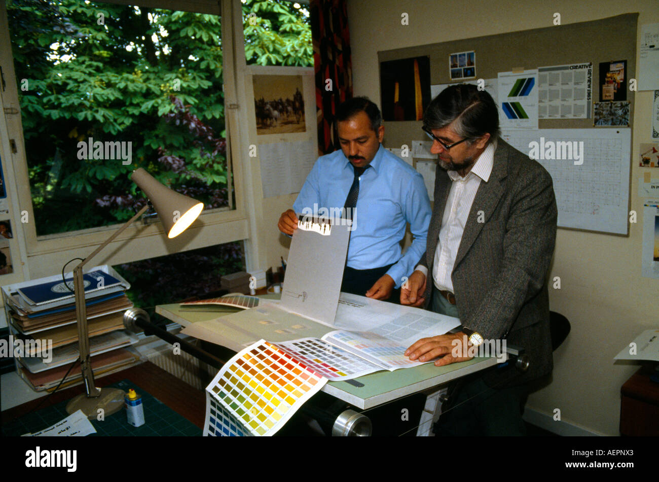 Design (magazine) Room Men Discussing Designs Stock Photo
