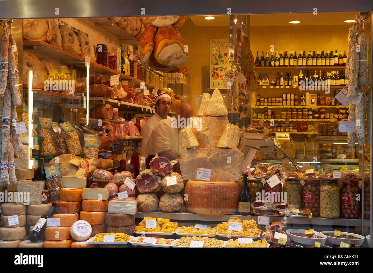Shop window with Parma hams and cheeses pasta salame olives wine etc