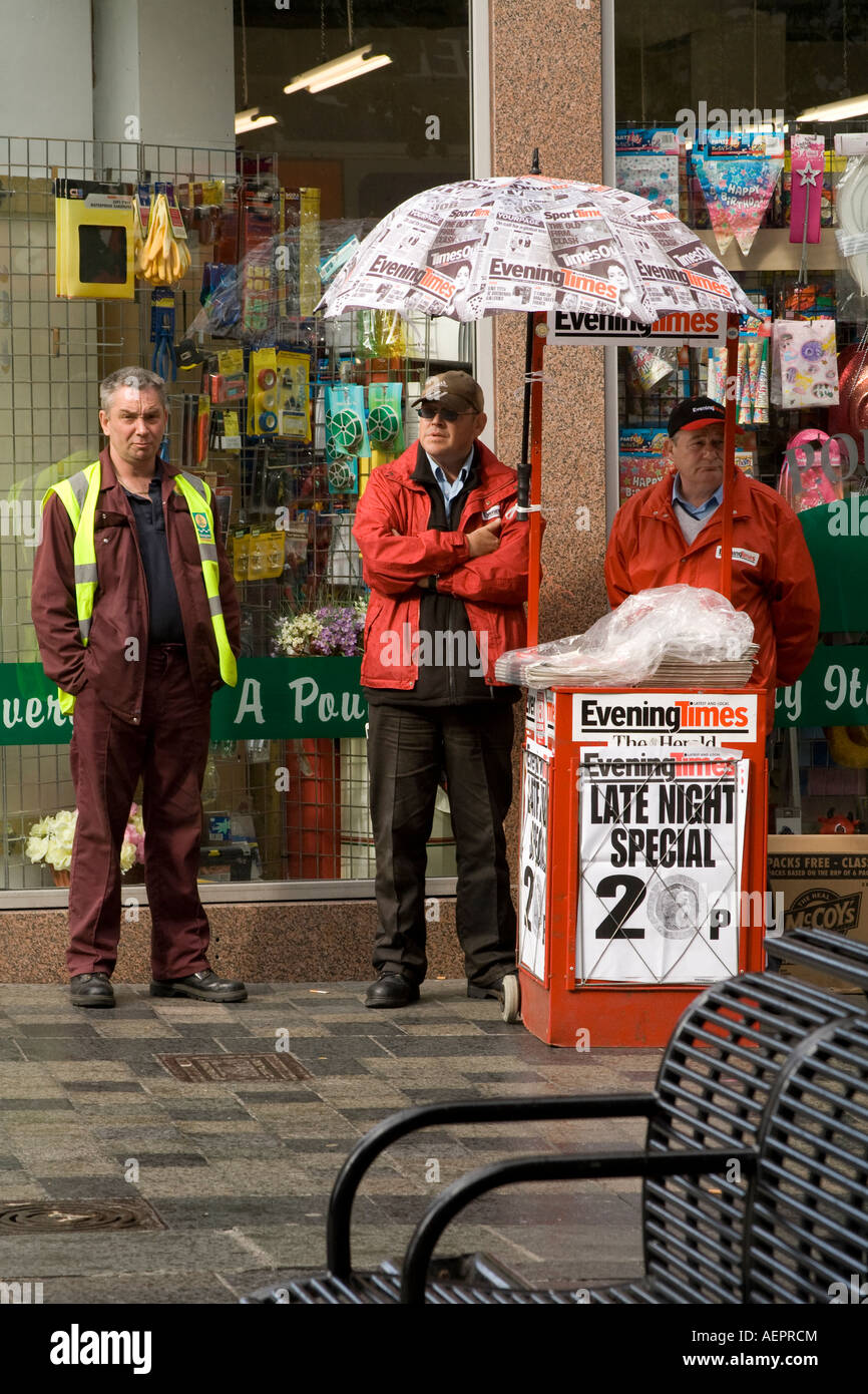 Newspaper sellers selling the "Evening Times" on Glasgow's Sauchiehall