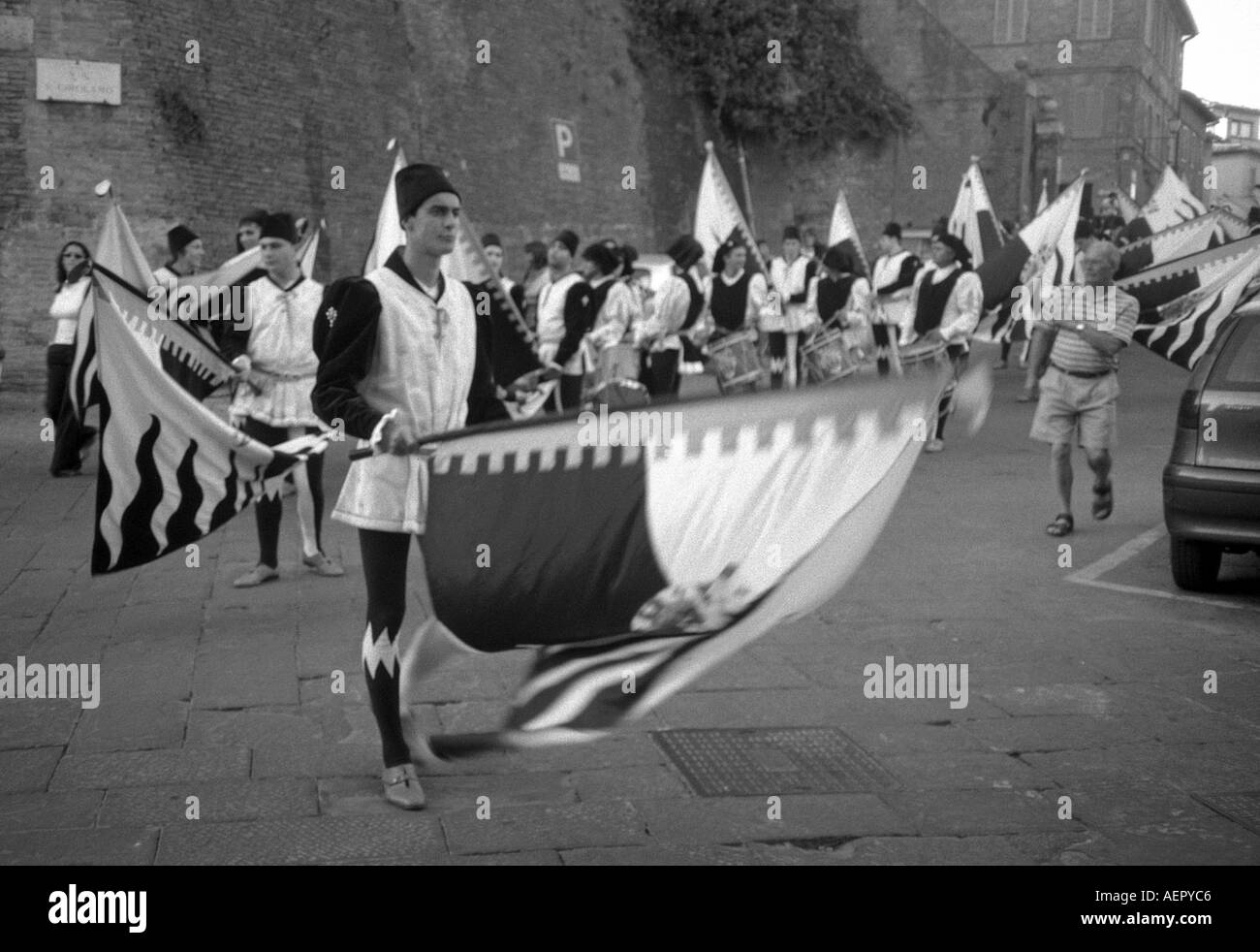 Colorful Street Parade of Flag Throwers in Medieval Costumes Palio UNESCO World Heritage Site Siena Central Italy Italia Europe Stock Photo