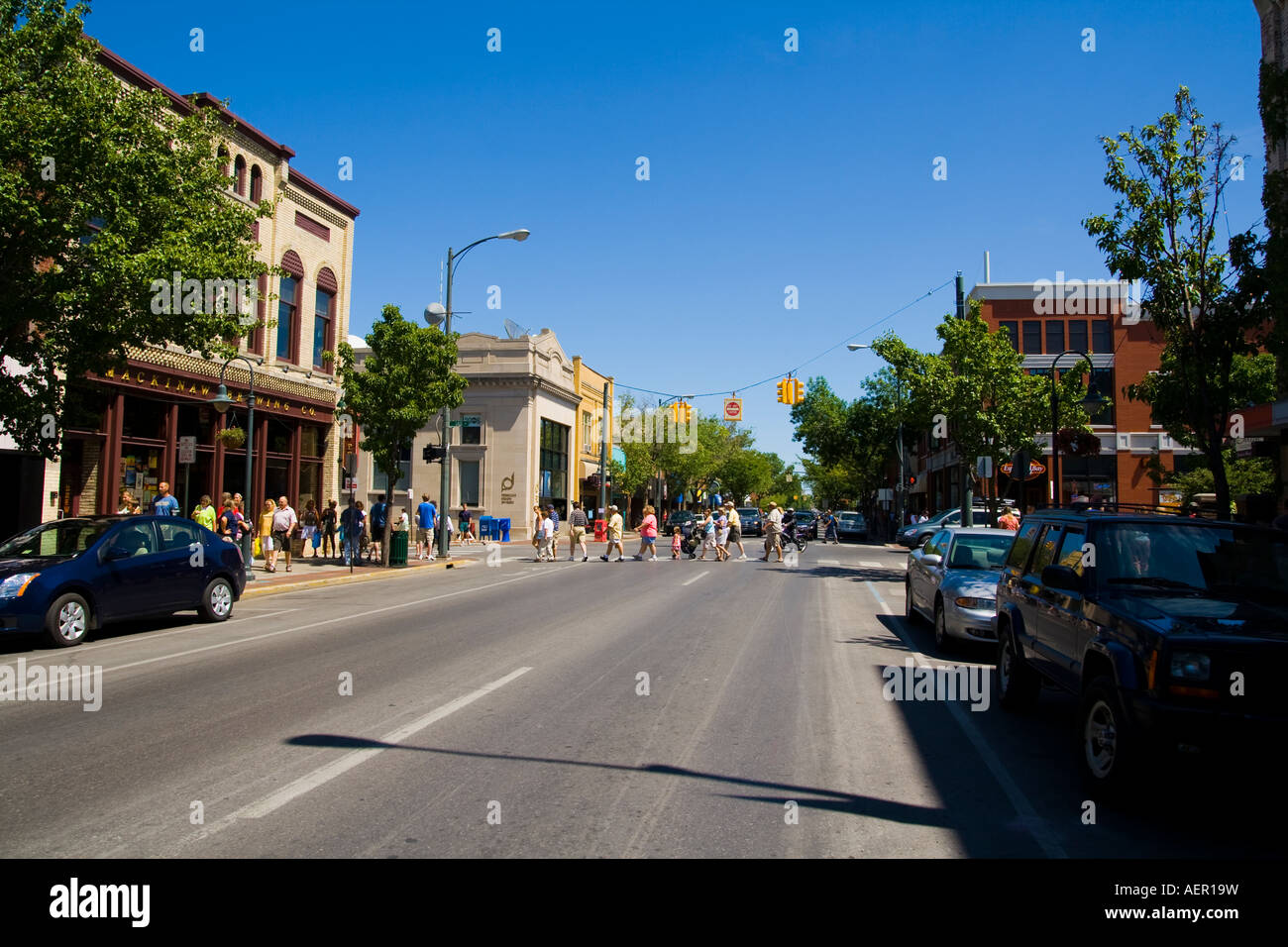 People crossing main street in downtown Traverse City Michigan Stock Photo