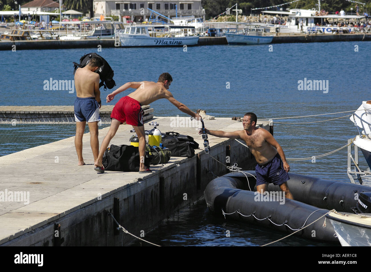 Three divers scuba diving in hi-res stock photography and images - Alamy