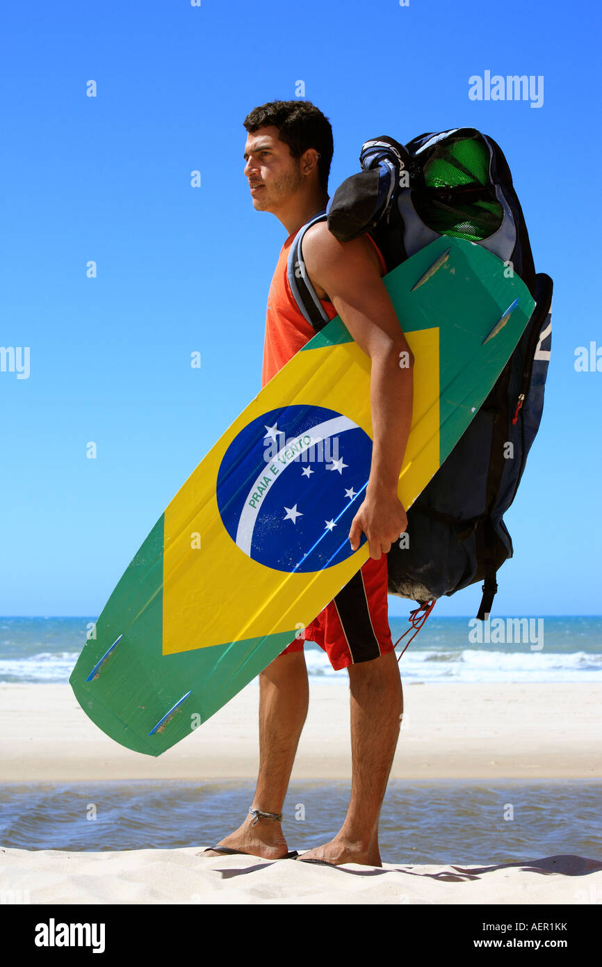 Kite surfer with the brazilian flag painted on the board with "praia e