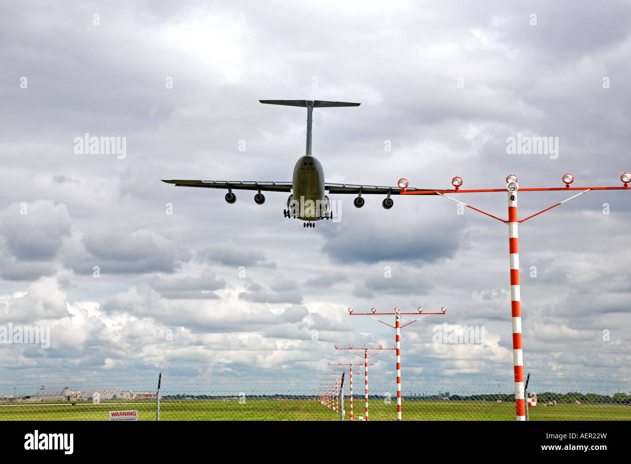 Aircraft C-5 landing AFB Base over runway and approach lights Stock ...