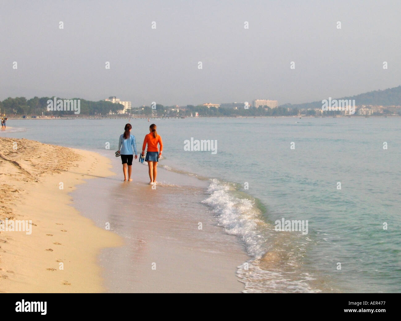 Two women walking on beach hi-res stock photography and images - Alamy