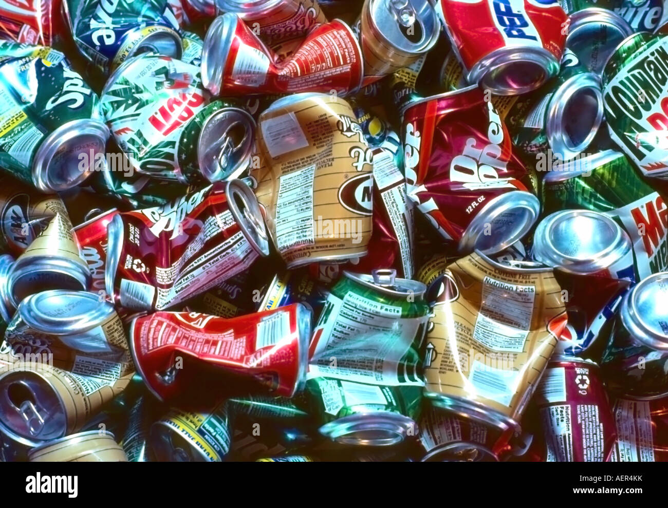 A background of semicrushed aluminum cans, using american product soda