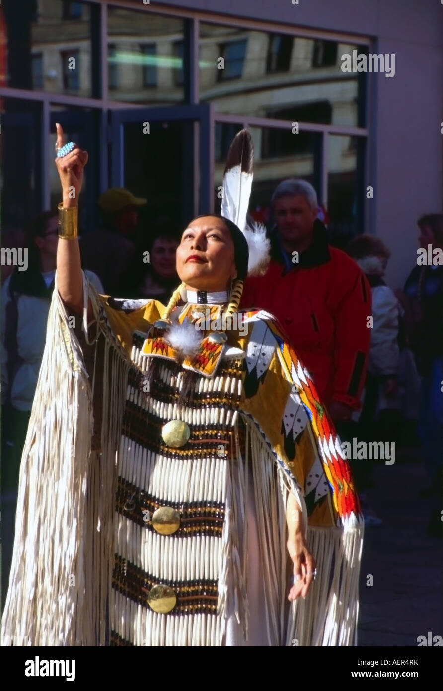 Native American performing a ceremonial dance on Main Street in SLC ...