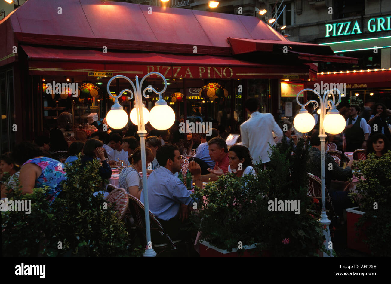 openair restaurant pizza nino at evening city of paris france editorial use only Stock Photo