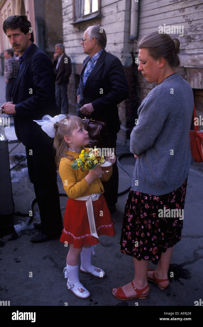 Riga Latvia Mother and her daughter who is holding a pint glass of the popular non alcoholic beer 1989 1980s HOMER SYKES Stock Photo