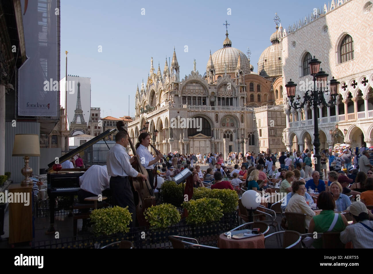 Musicians and patrons at the Gran Cafe Chioggia across the piazza from the Doges Palace Venice Italy Stock Photo