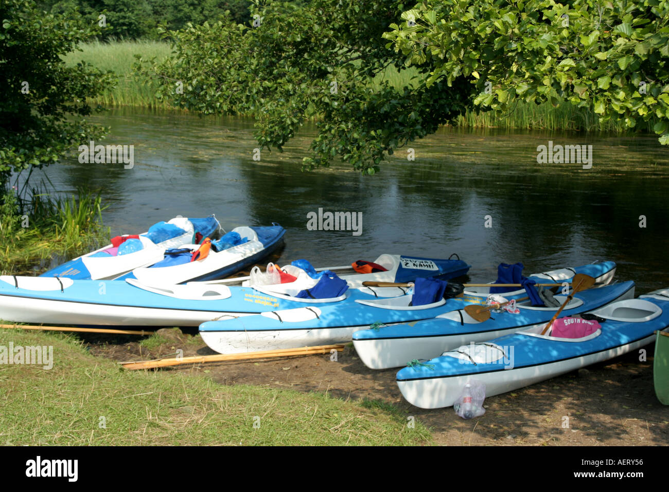 Kayaks on Czarna Hancza river bank Stock Photo