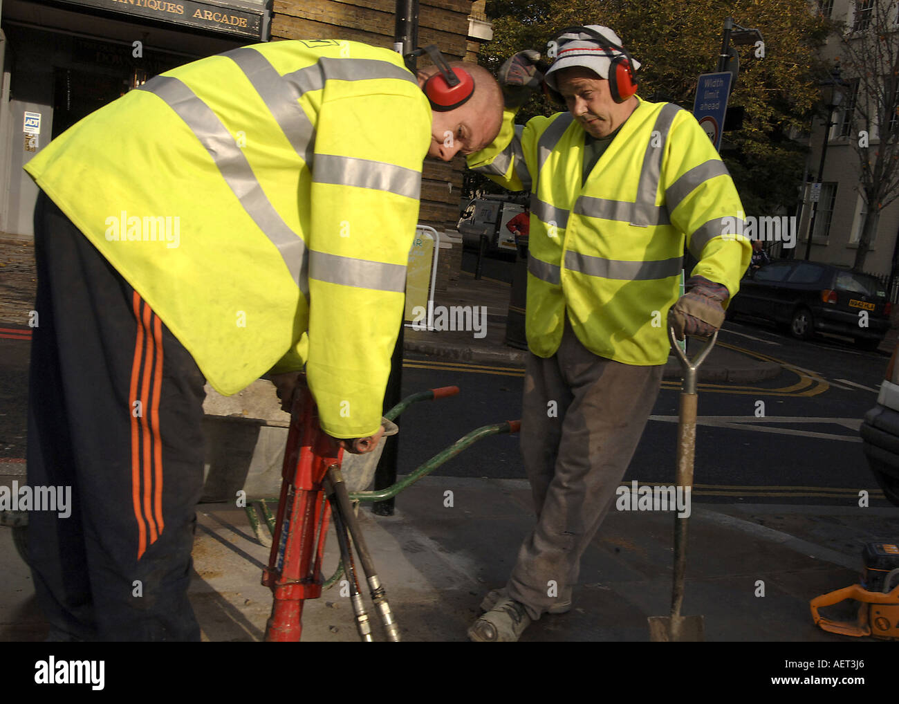 Roadworks team fix a footpath in Angel, London UK Stock Photo