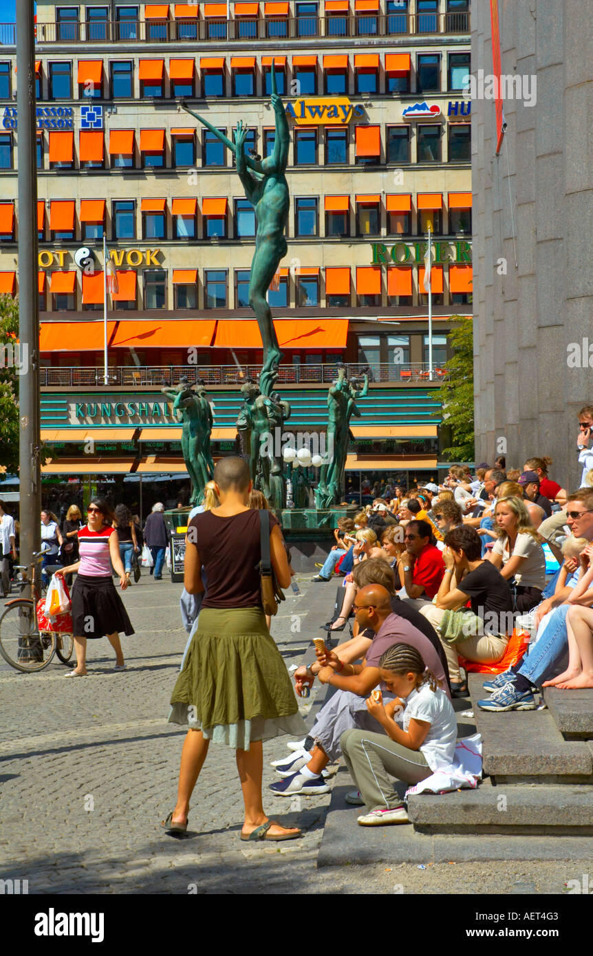 People sitting on the steps of Konserthuset at Hötorget square in Stockholm Sweden EU Stock Photo