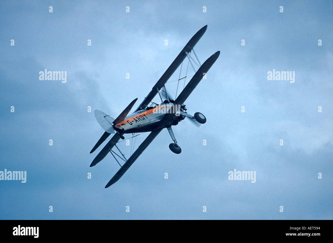 Shearman Biplane Flying in Cloudy Sky Stock Photo - Alamy