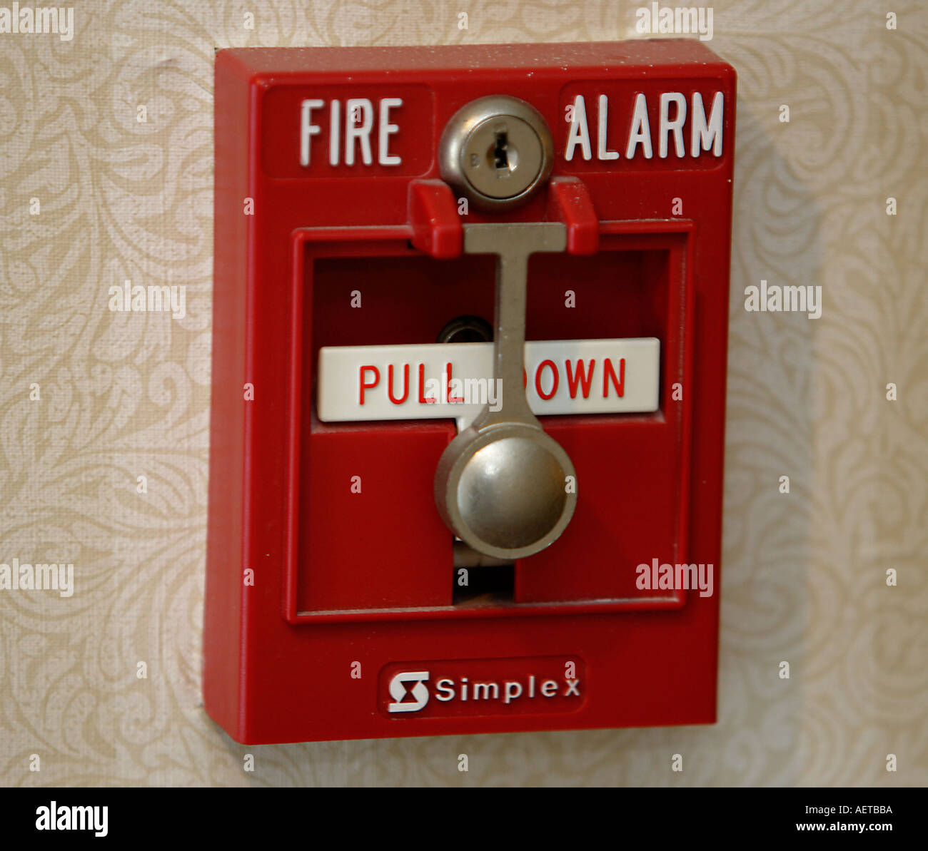 Fire alarm box on a wall - Stock Image