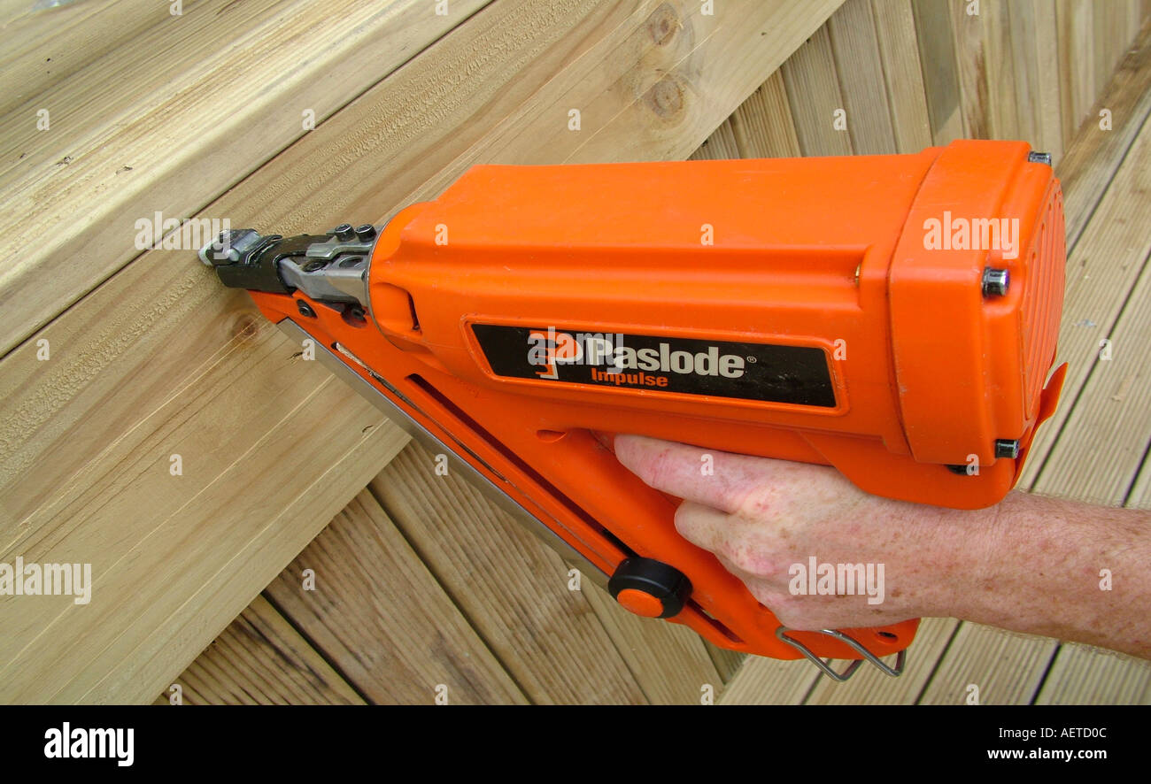 Hand holding Paslode nail gun framing gun Stock Photo Alamy