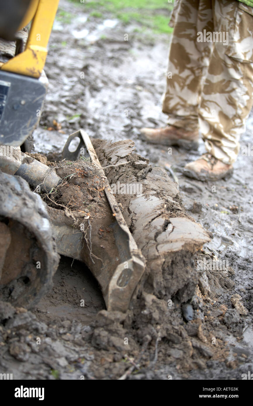 BREAKING GROUND WITH A DIGGER ON A CONSTRUCTION SITE Stock Photo - Alamy