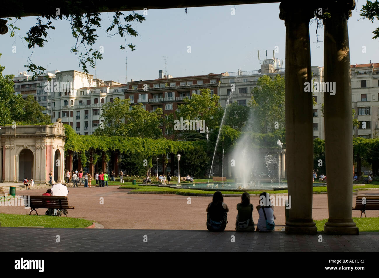 Three young girls watching fountain in Dona Casilda Iturrizar Park Bilbao Stock Photo