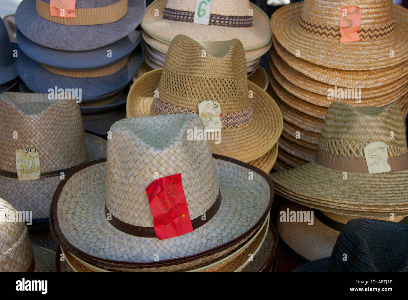 A selection of straw sun hats for sale on a typical French market,  Languedoc Roussillon. South of France Stock Photo - Alamy