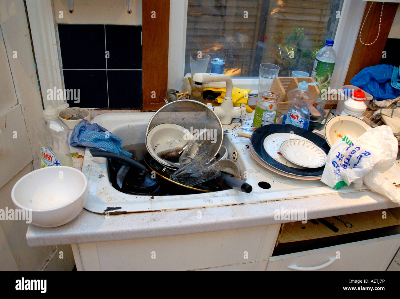 Filthy kitchen sink with dirty dishes to be washedup Stock Photo Alamy