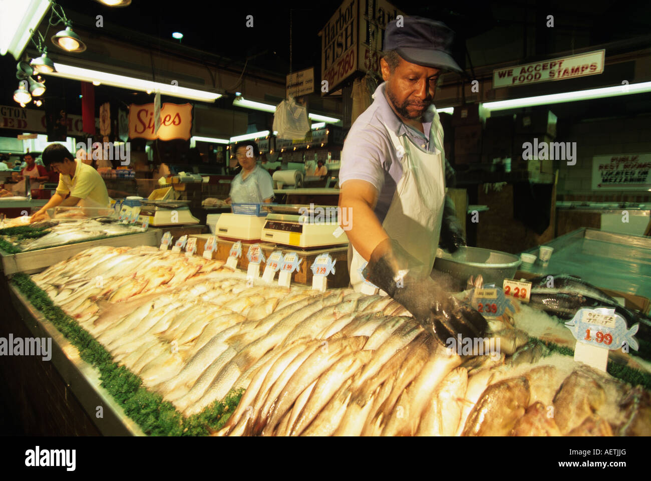 USA Maryland MR Arthur Taylor sorts lake trout at fish stall at