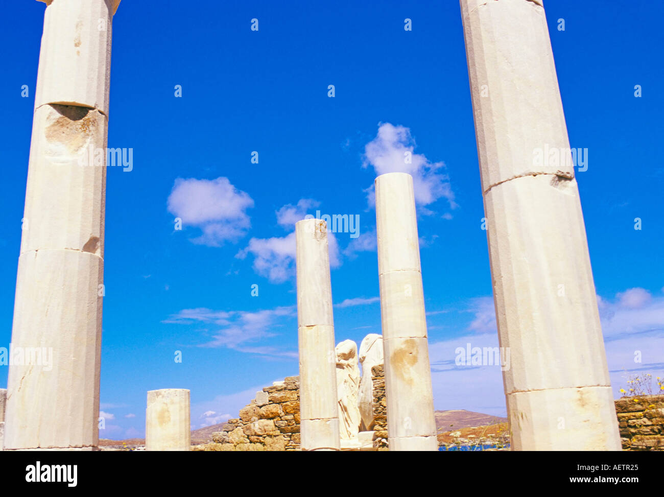 Columns surrounding ancient statues of Cleopatra and Diocrides archaeological site of Delos UNESCO World Heritage Site Cyclades Stock Photo