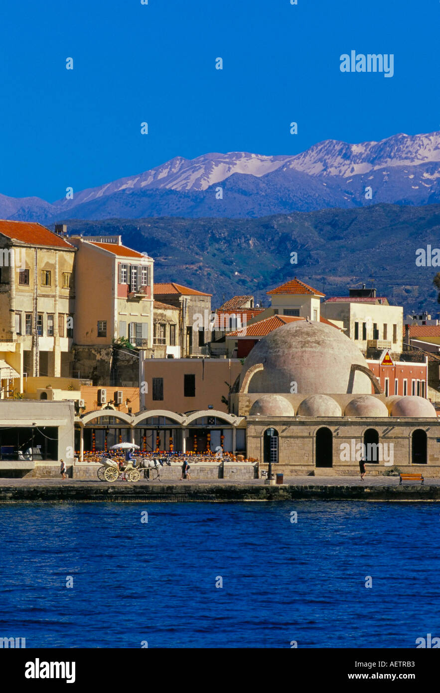 Hania Chania seafront and Levka Ori White Mountains in the background Hania island of Crete Greece Mediterranean Europe Stock Photo