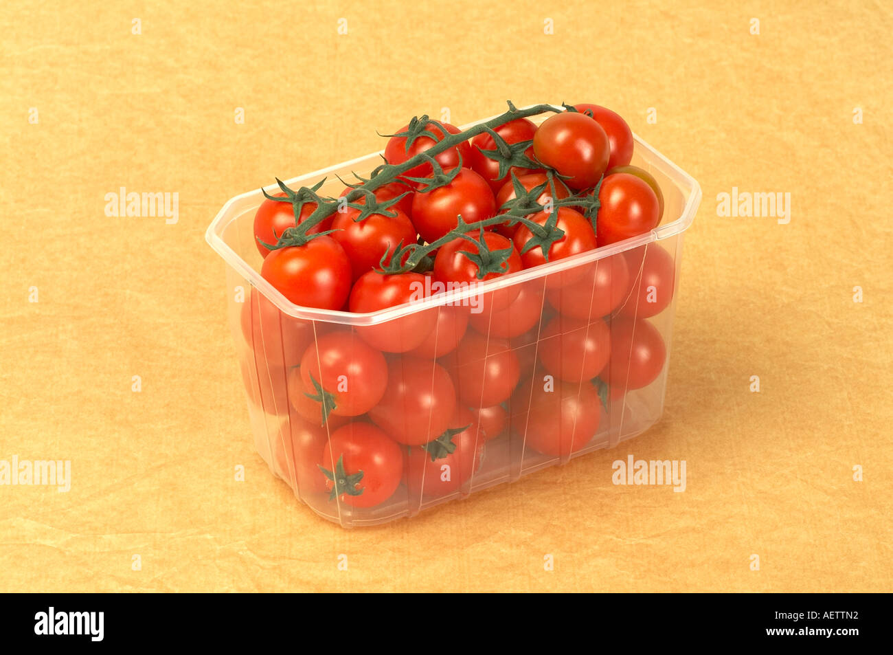 Download Cherry Tomatoes In Plastic Container On Yellow Background Stock Photo Alamy Yellowimages Mockups