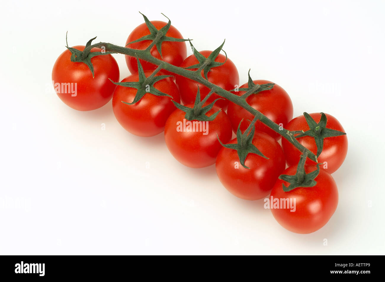 Bunch of cherry tomatoes on white background Stock Photo - Alamy