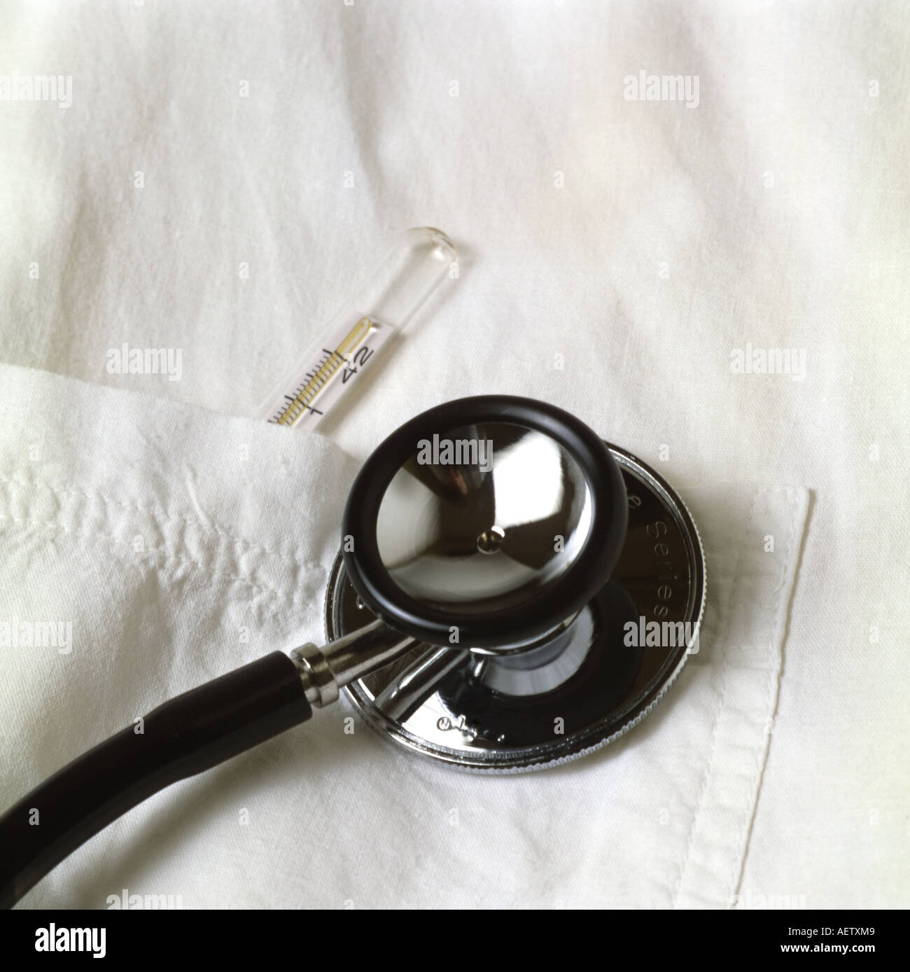 Stethoscope and thermometer in a pocket Stock Photo