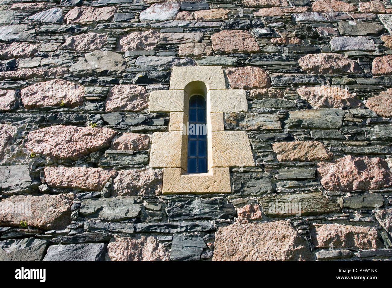 Inset windows in pink granite walls of the ruins of Augustine medieval
