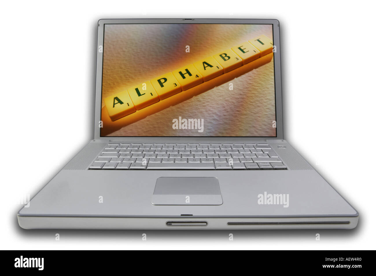LAP TOP COMPUTER WITH SCRABBLE LETTERS ON SCREEN SPELLING WORDS ALPHABET Stock Photo