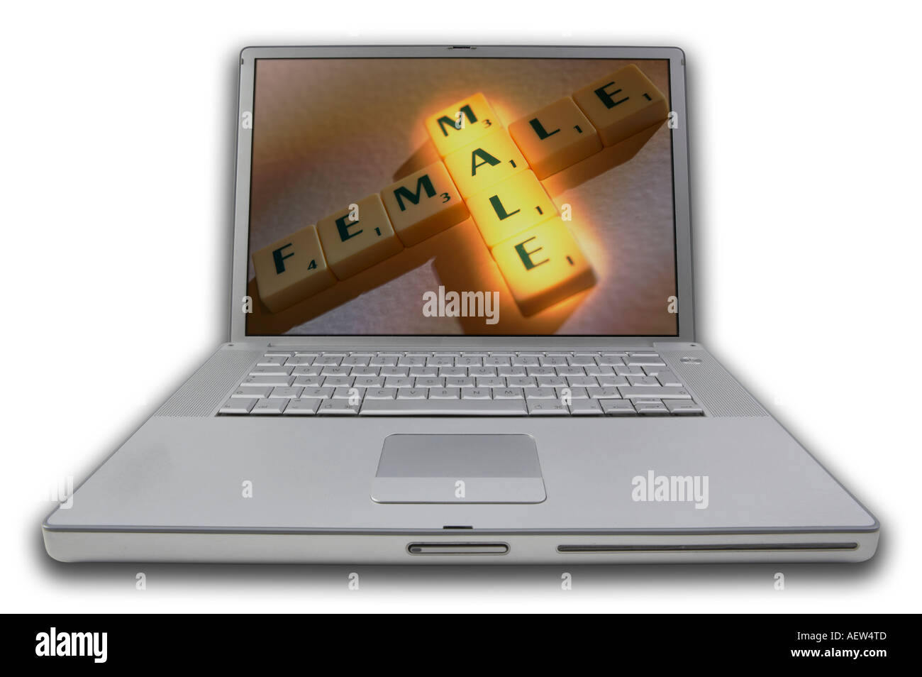 LAP TOP COMPUTER WITH SCRABBLE LETTERS ON SCREEN SPELLING WORDS MALE FEMALE Stock Photo